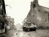 m-10-tank-destroyer-passing-through-an-unknown-german-town-in-1945.jpg