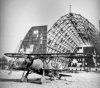 Damaged_hangar_with_CR_42_at_Grottaglie_1943.jpg